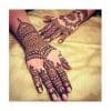 Mehandi design in a woman hand